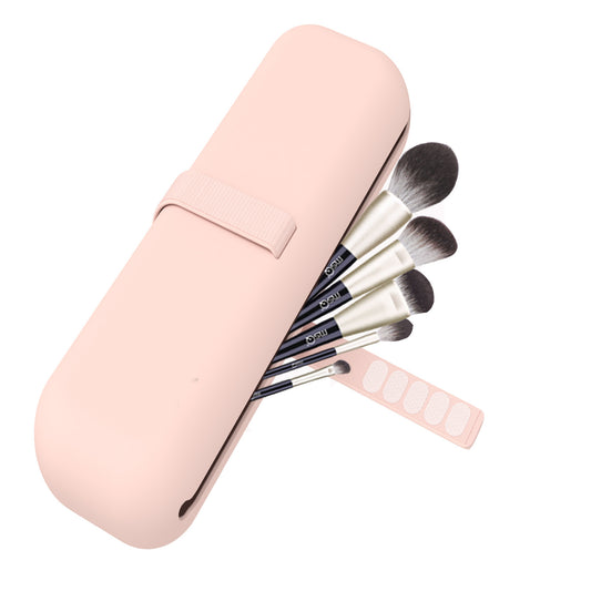 Set of makeup brushes in a pink case on a white background