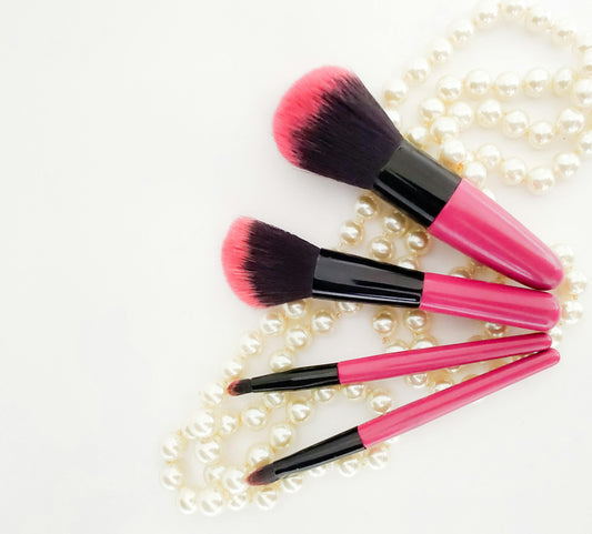 Clean makeup brushes arranged on white background - complete cleaning guide