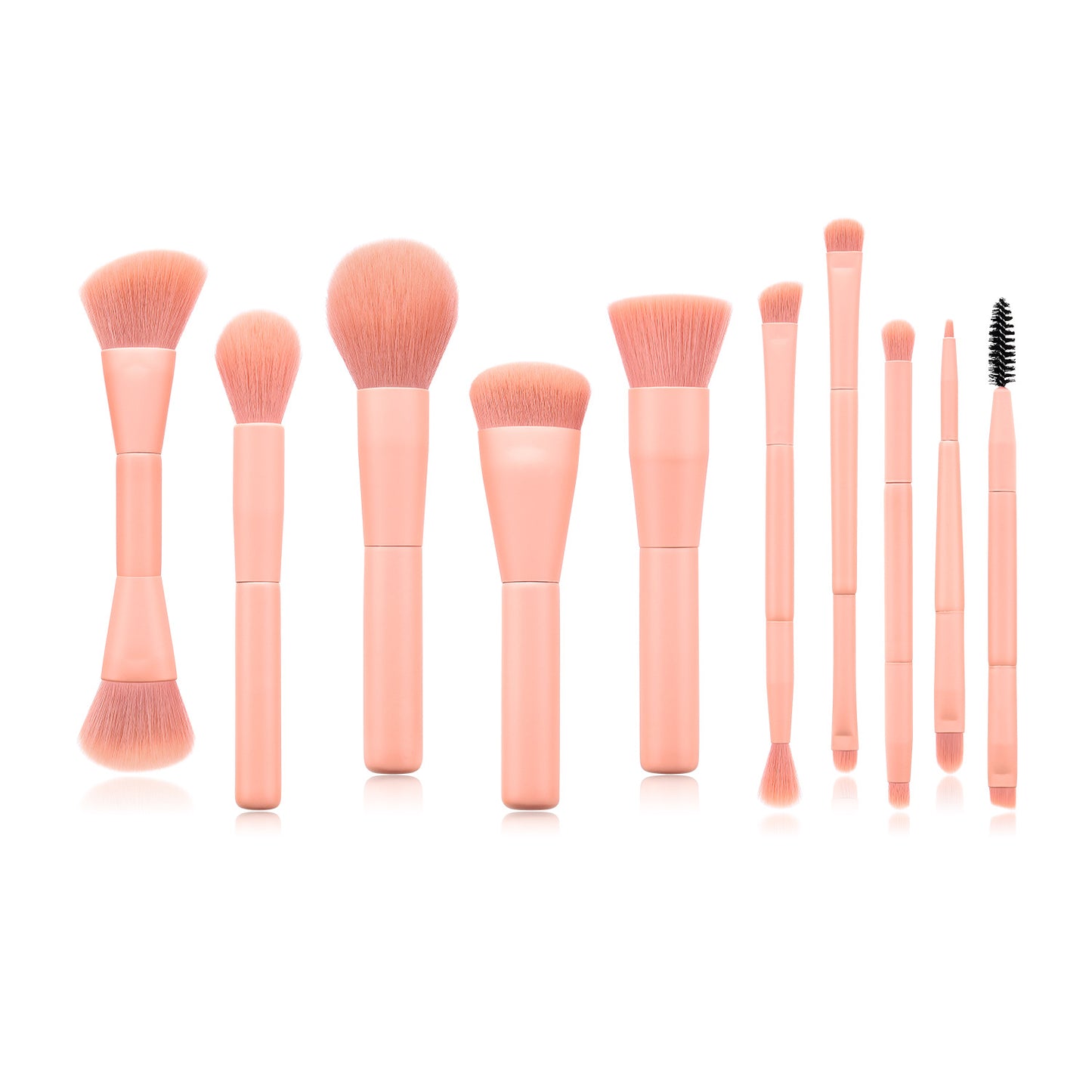 Set of pink makeup brushes on a white background